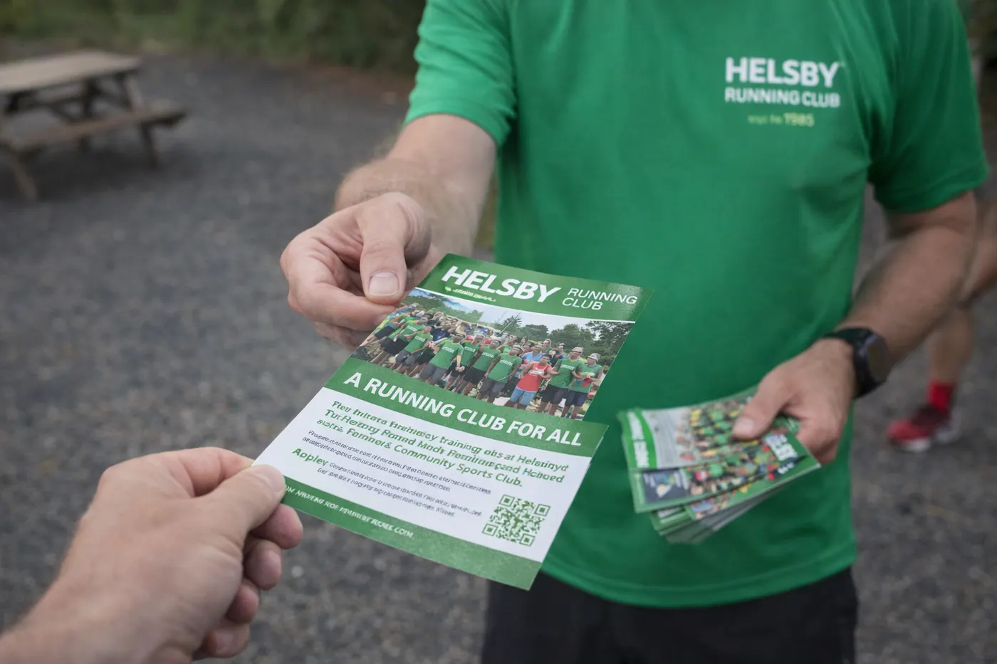 Person handing out printed leaflets